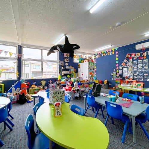 Colourful preschool classroom with toys, children's furniture, and educational decorations, creating an engaging learning environment for young kids in New Zealand.