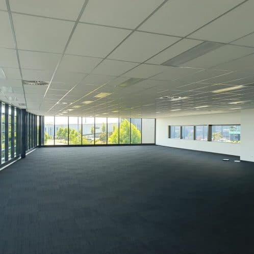 Spacious modern commercial office space with large windows and natural light, ideal for business offices and corporate environments in New Zealand.