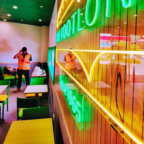 Neon ‘The Footlong Since 1965’ feature sign installed during Subway Fresh Forward 2.0 interior refurbishment.