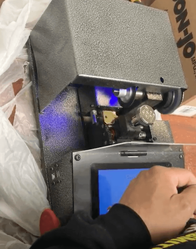 Locksmith Duplicating Car Key For Someone Who Search Car Key Replacement Near Me