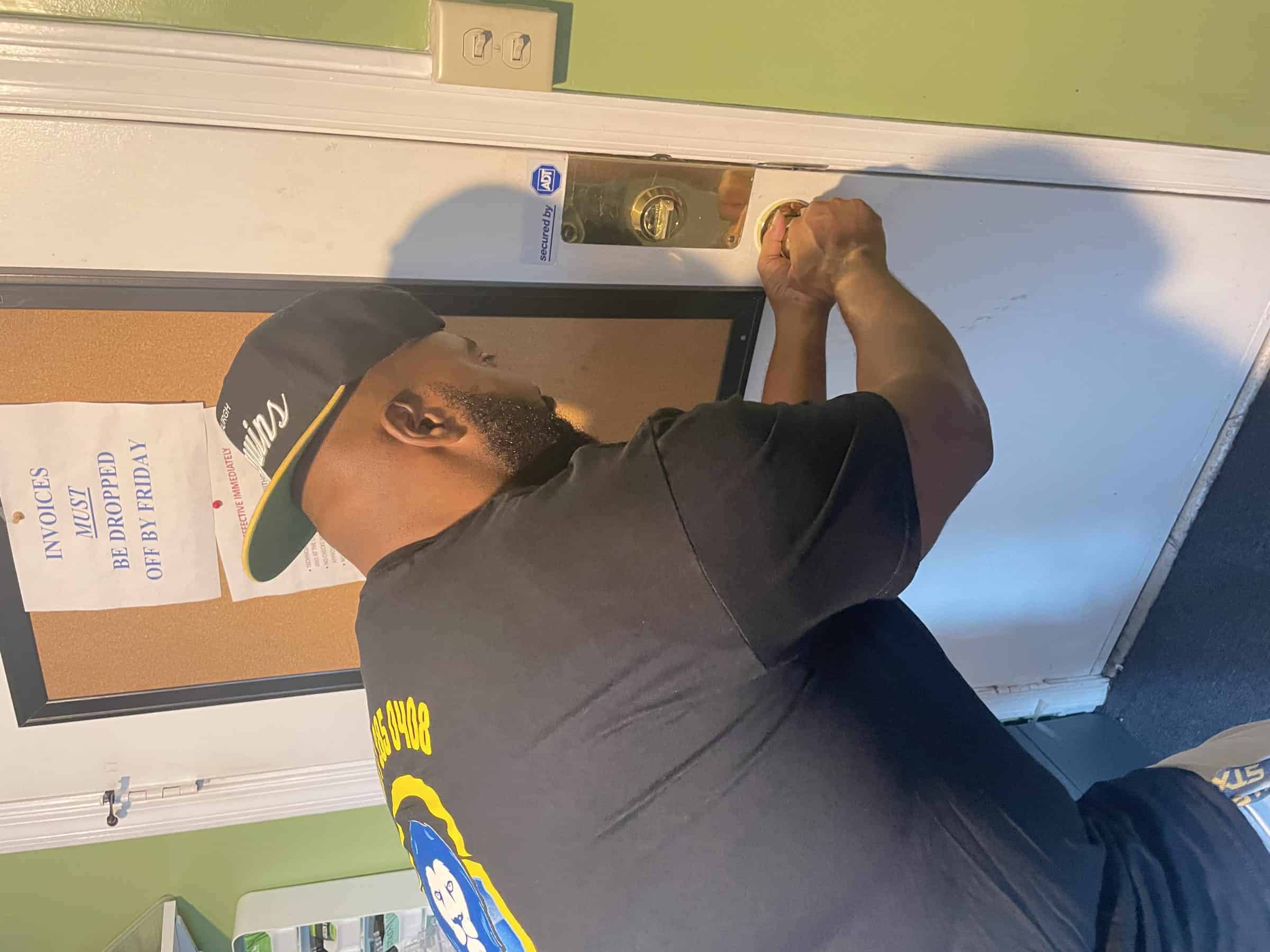 Columbia Md Locksmith Columbia Md Locksmith In Black King Locksmith Uniform Repairs Door Knob, Available For Emergency Lockouts.