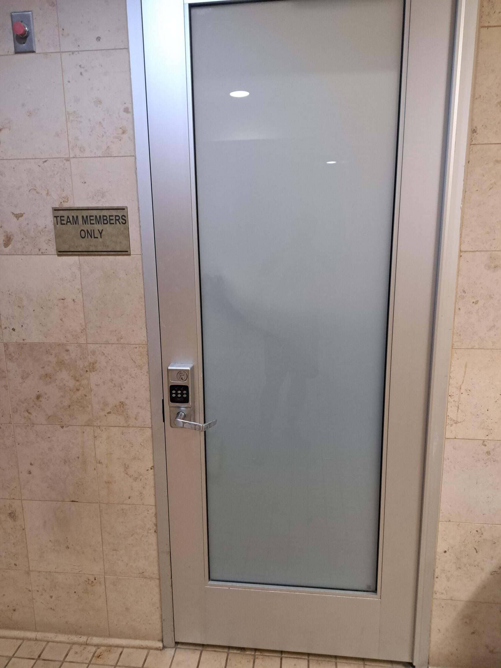 A Close-Up View Of A Meticulously Crafted Custom Door Who Inquires Commercial Security Door Near Me