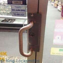 A Skilled Technician Doing Security Door Installation With Precision Tools.