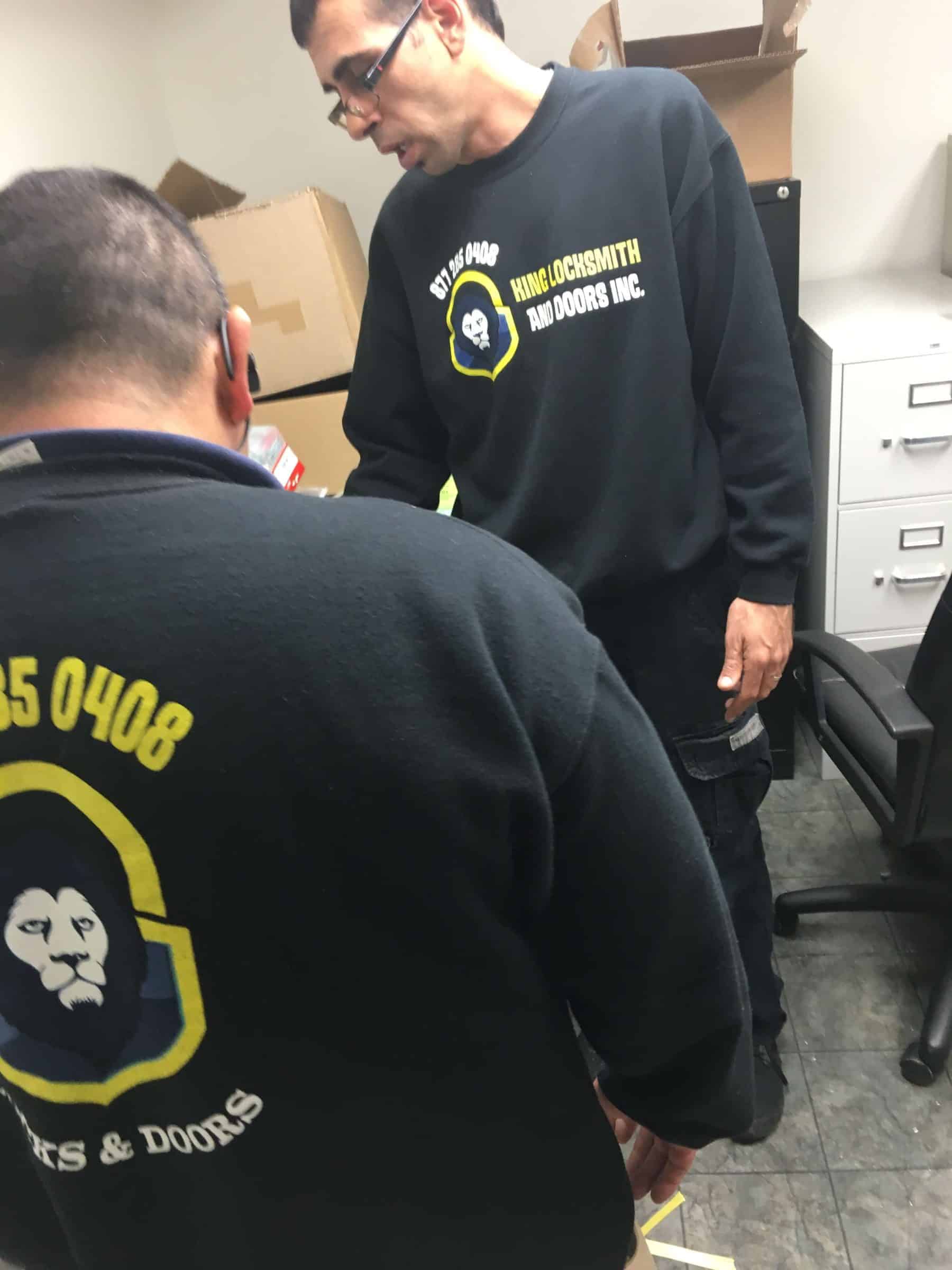 24/7 Locksmith A Group Of Locksmiths Discussing Plans Before Providing Their 24/7 Locksmith Service