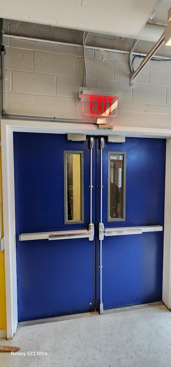 A White Commercial Door With A Panic Bar Installed, Representing Emergency Commercial Door Repair.&Lt;/P&Gt;
&Lt;P&Gt;