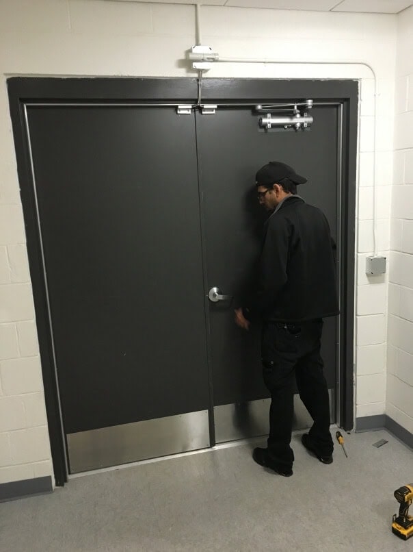 Image Of A Black Door With A Panic Bar Recently Installed, Repaired By King Locksmith In Md