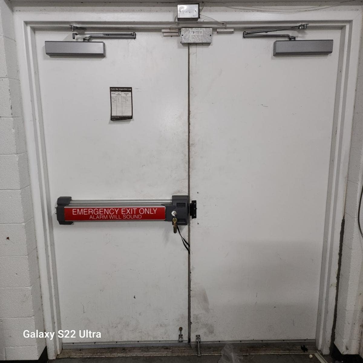 Exit Door With Panic Bar, Showcasing One Of The Best Commercial Access Control Systems.