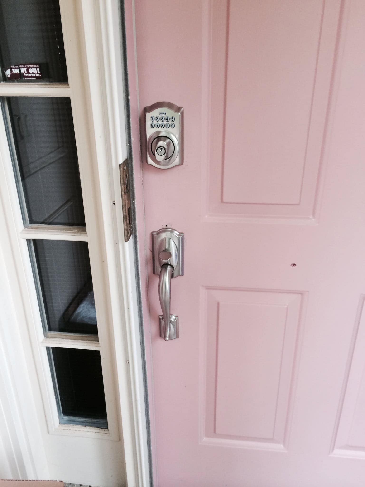 A Pink Door With A Secure Lock, Representing The Need For Commercial Lock Replacement Service For Enhanced Security.