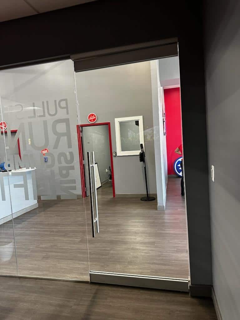 A Commercial Glass Door With A Silver Handle, Representing Services Provided By A Commercial Locksmith.