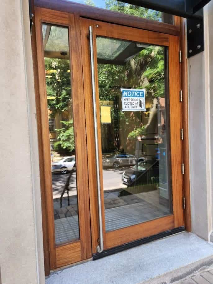 Locksmith Frederick Md A Brown-Framed Door With A Glass Door Installed By Locksmith Frederick Md