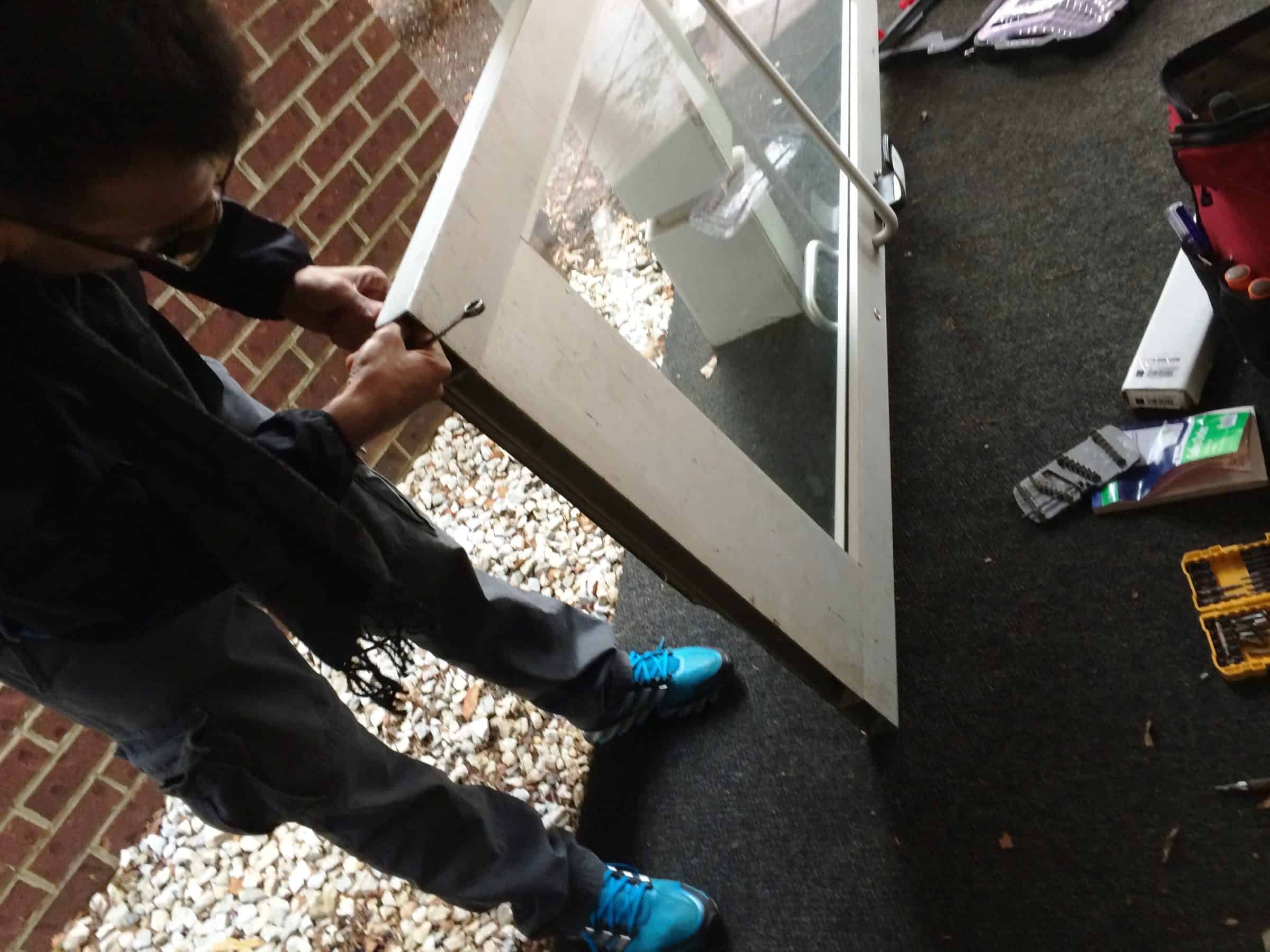  A Locksmith Gaithersburg Md Repairing A Door.
