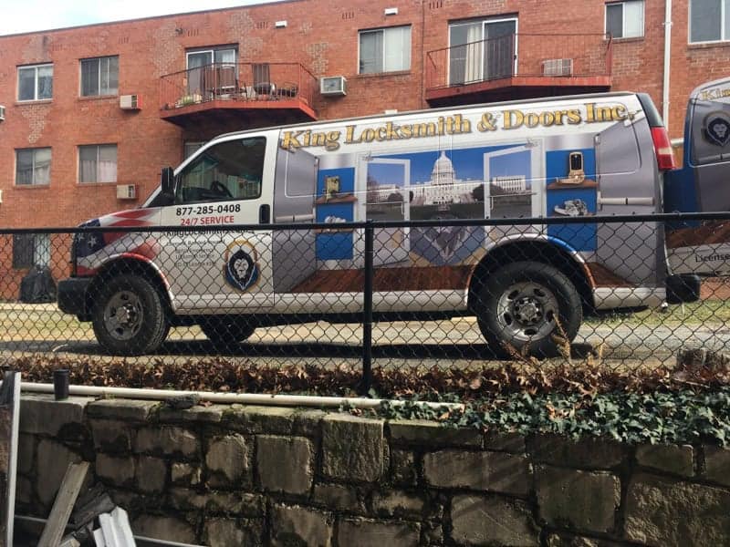 A Mobile Locksmith In Glen Burnie Md Van Parked Near The Fenced.