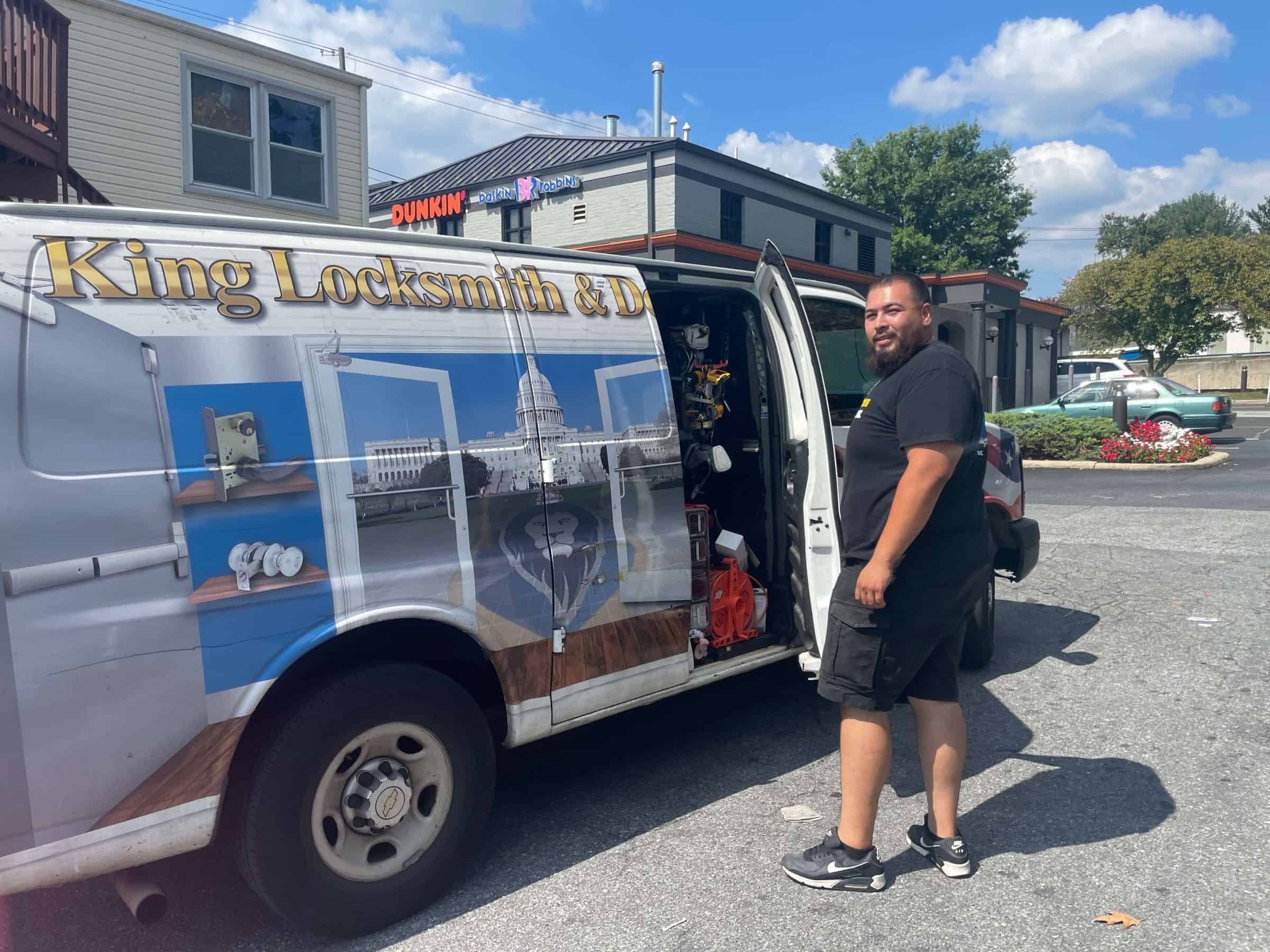 A Locksmith Linthicum, Md Walking Confidently Towards A Mobile Van