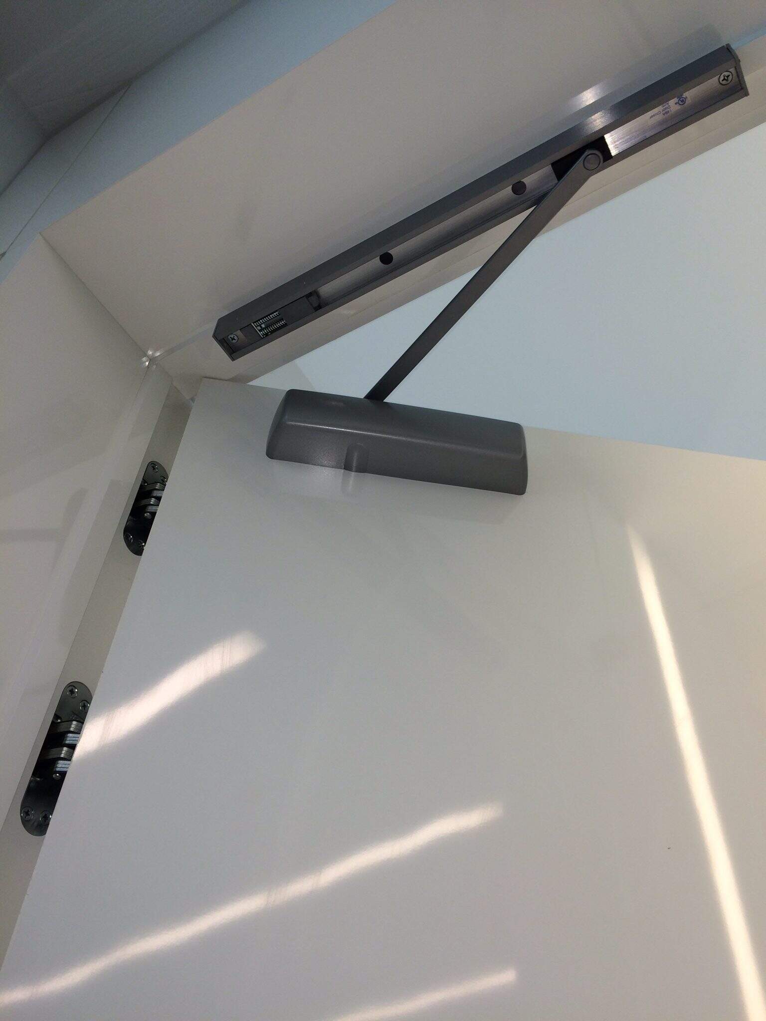 White Door With Door Closer Installed By Montgomery Locksmith