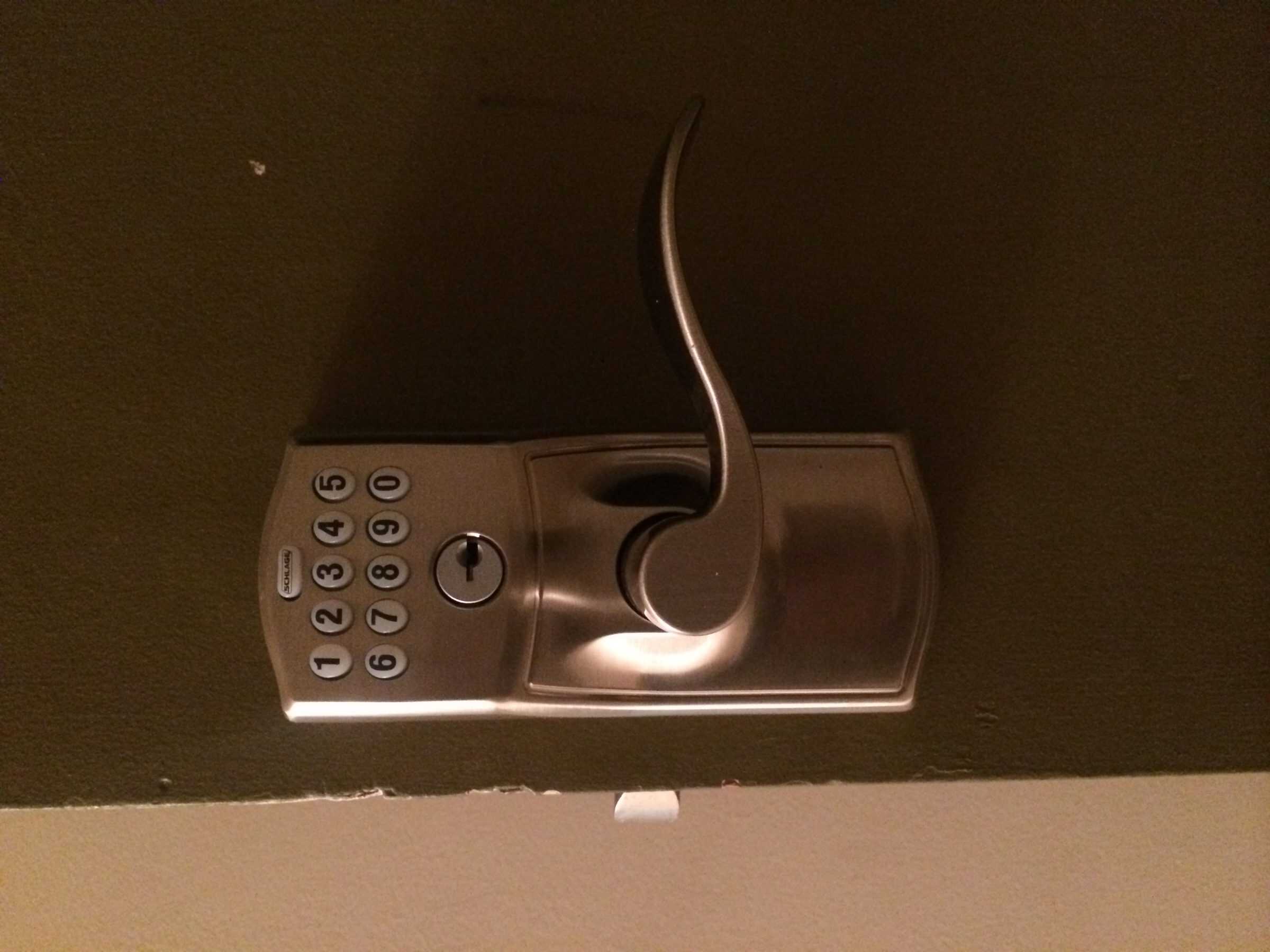 A Brown Door Featuring A Golden Keyless Entry Lock Installed By King Locksmith, The Smart Lock Installer In Md And Dc
