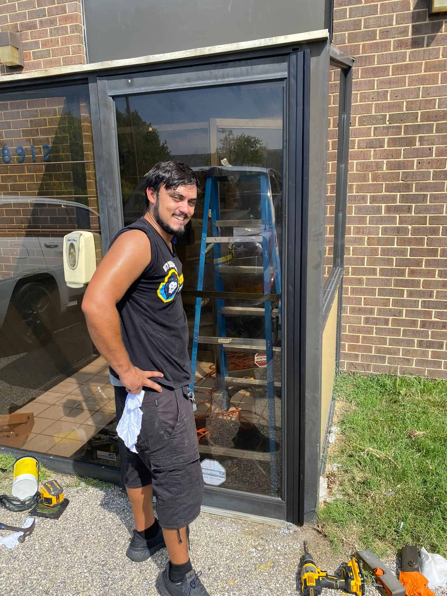 King Locksmith Odenton Md Is Repairing The Storefront Door.