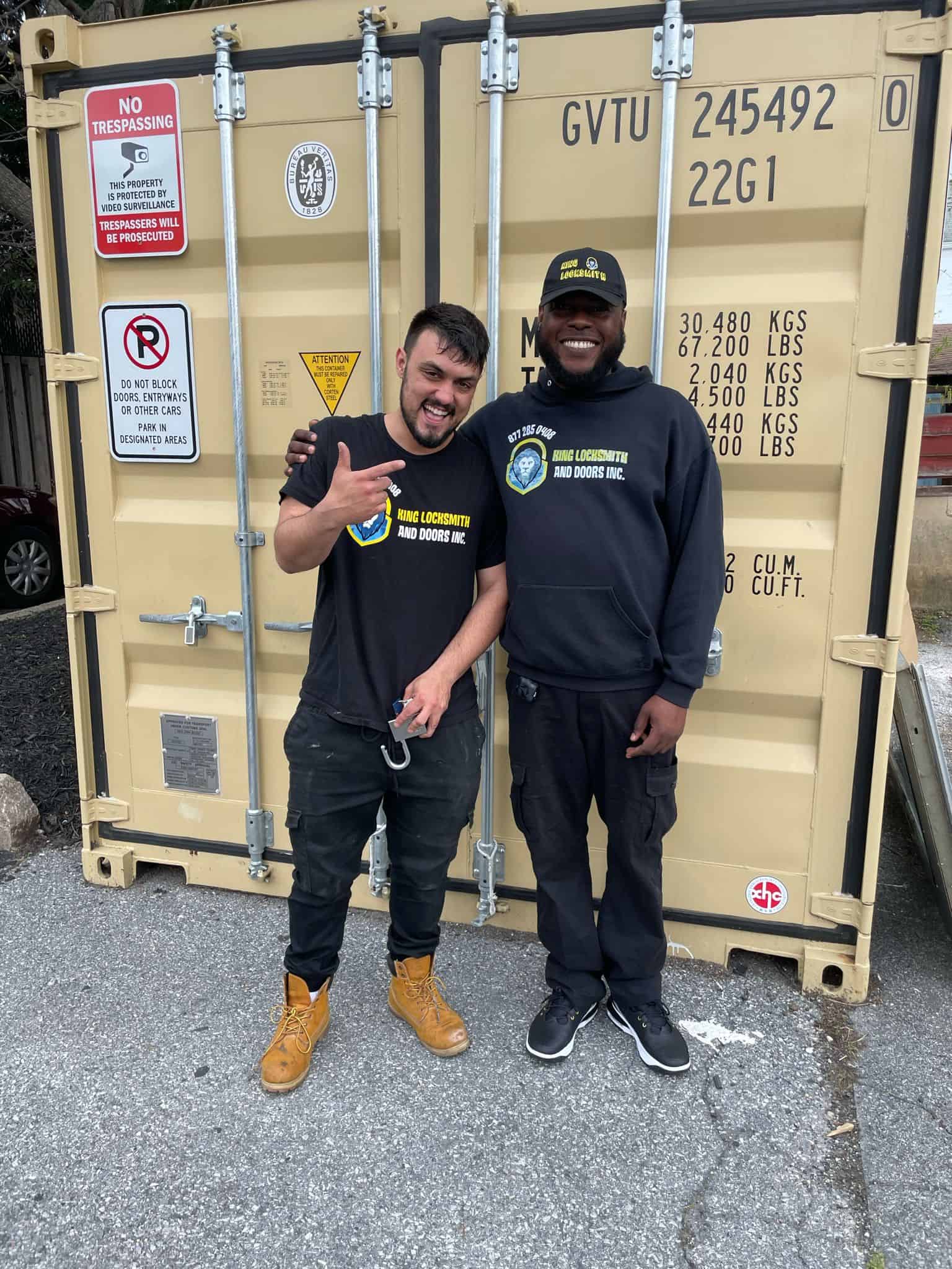 Two Locksmiths Are Smiling After Troubleshooting The Reefer Van'S Lock And Key. Instead Of Searching For The Nearest Automotive Locksmith In Odenton, Choose Us Today