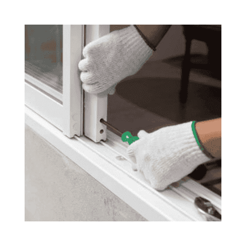 Locksmith With White Gloves Repairing The Door Roller In A Sliding Door At Ellicott City Md