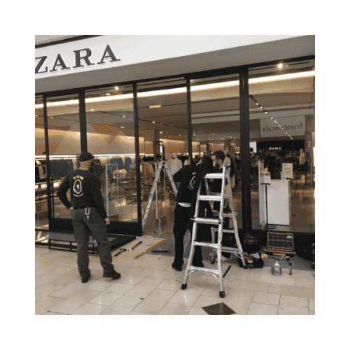Locksmiths In Black Repairing The Storefront Door In Germantown Md