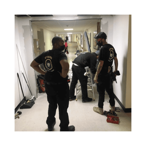 King Locksmith In Their Black Uniform Repaired And Installed Traffic Doors In Germantown Maryland