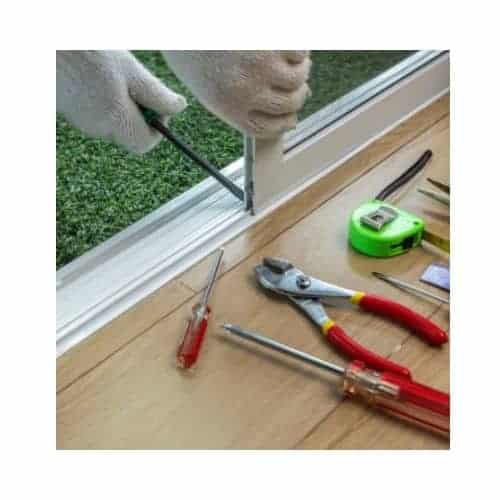 Locksmith With White Gloves And Tools Repairing The Door Roller In A Sliding Door At Burtonsville Md