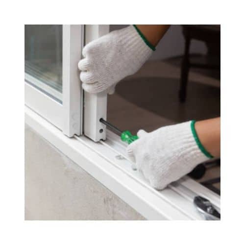 Locksmith With White Gloves Repairing The Door Roller In A Sliding Door At Burtonsville Md