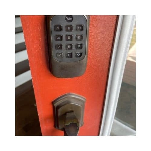Red Door With Black Keypad Needs A Repair In Burtonsville Maryland