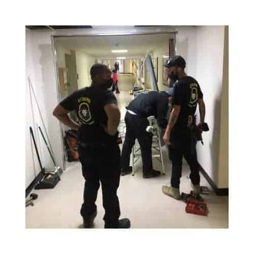 King Locksmith In Their Black Uniform Repaired And Installed Traffic Doors In Burtonsville Maryland