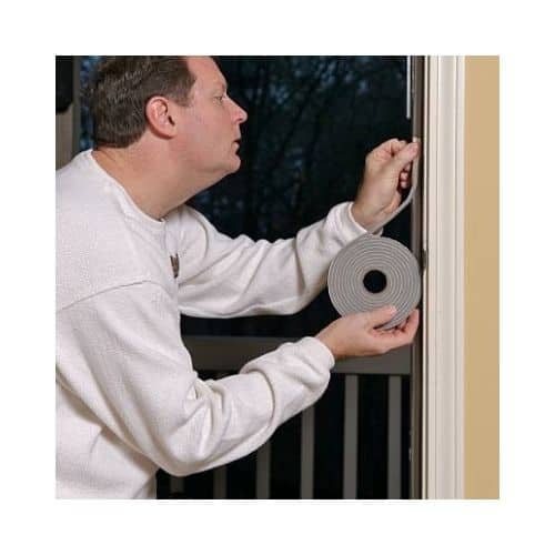 Man In A White Sweat Shirt Doing Weather Stripping In His Door At Burtonsville Maryland