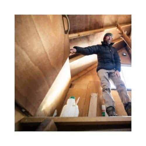 Man In Attic Holding The Door That Need To Be Repair In Catonsville