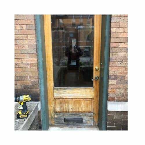 Yellow With Green Frame Single Door Was Repaired In Catonsville Md By King Locksmith And Doors Inc.