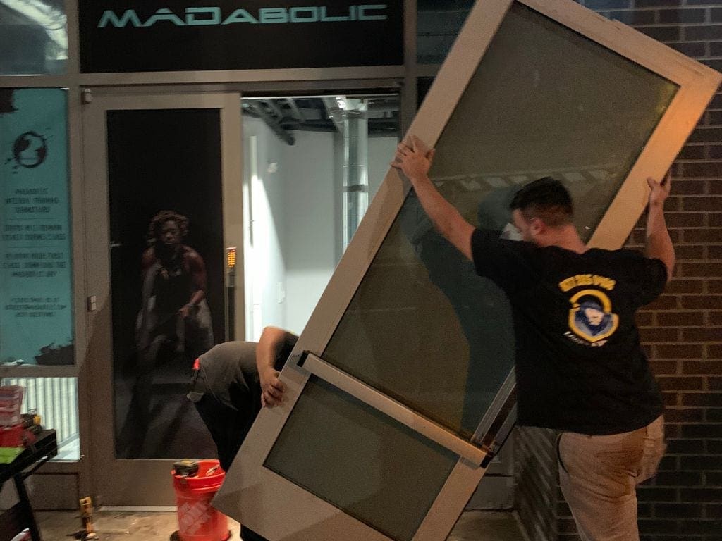 Commercial Locksmith King Locksmith'S Staff Lifted The Door For Door Installation