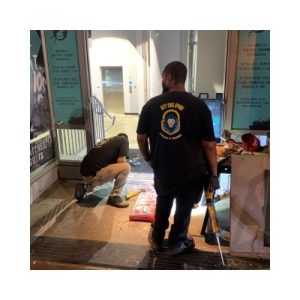 Our Locksmith Owings Mill, Baltimore County, Md Services Two King Locksmith Staff Members Wearing Black Uniforms In Md And Dc, Repairing An Door Frame In Owing Mills Two King Locksmith Staff Members Wearing Black Uniforms In Md And Dc, Repairing An Door Frame In Owing Mills