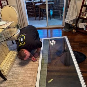 A Georgetown Locksmith Working On A Residential Lock, Showcasing Professional Locksmith Services For Homes.