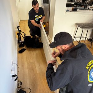Our Residential Locksmith Crofton Working On A Home Door Repair, Demonstrating Precision And Care.