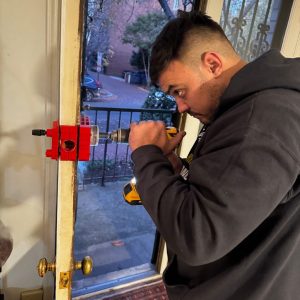 Our Locksmith Fort Meade Installing A Residential Door Lock Using Professional Tools For Enhanced Home Security.