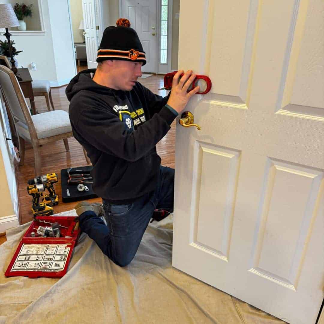 King Locksmith Technician Installing And Aligning Door Lock Hardware During On-Site Service By A Locksmith Rockville Md, Restoring Secure And Consistent Access For A Property Entry