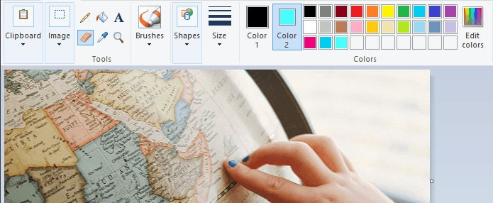 Set the background color to one not frequently used and erase to start making the background transparent in Paint
