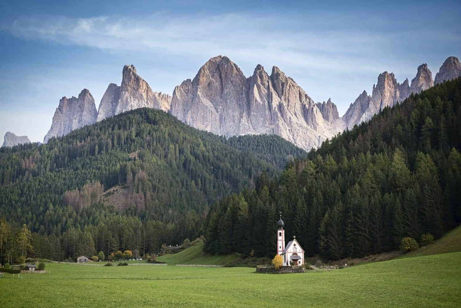 chiesetta di san giovanni in val di funes dolomites italy with Seceda mountains in the background