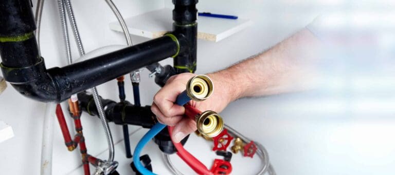 A Moore Home Services technician carefully prepares to connect hose fittings beneath a sink, ensuring your plumbing system is repaired with precision and care. You can trust our team for clean, hassle-free service—backed by our satisfaction guarantees—to keep your home’s plumbing running smoothly.