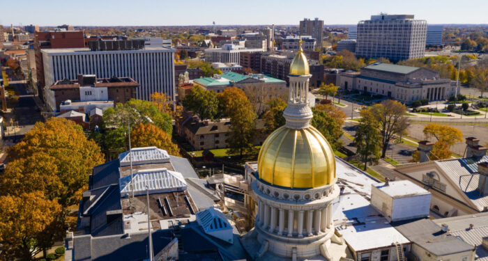 The state capital dome reflects sunlight late afternoon in downtown Trenton New Jersey