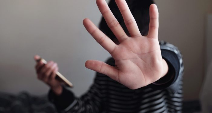 Consumer signaling stop while on cellphone
