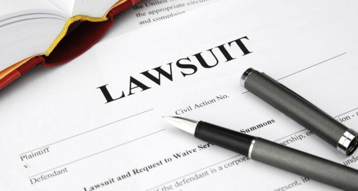 lawsuit form with filler and book