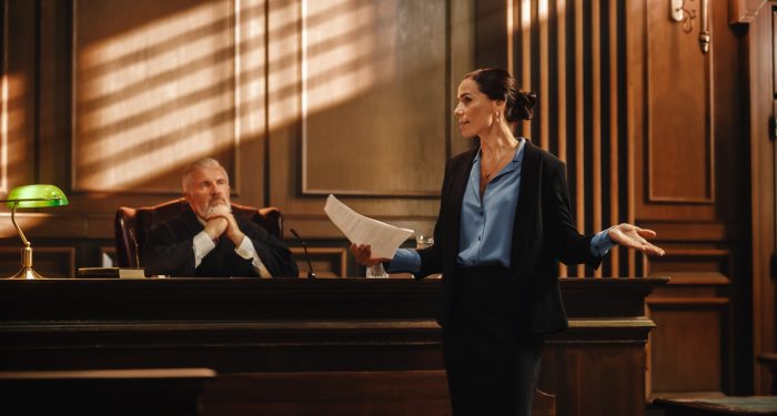 Attorney presenting arguments in courtroom, illustrating attorney-client privilege risks with AI use in litigation