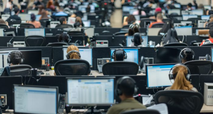 A bustling call center with rows of agents fielding customer inquiries and providing support
