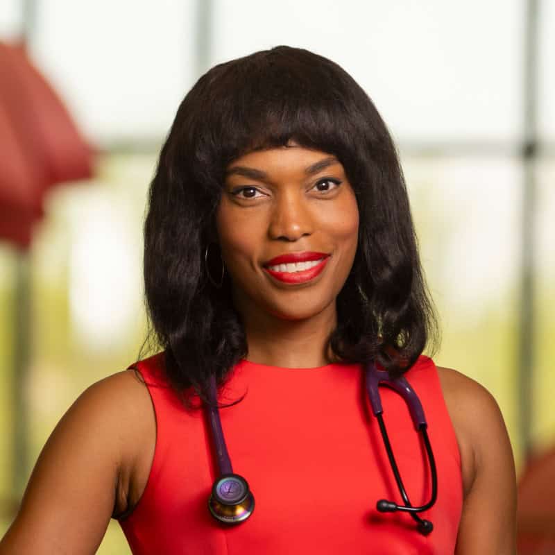 Headshot of a women in a red dress | Amanda Alexander