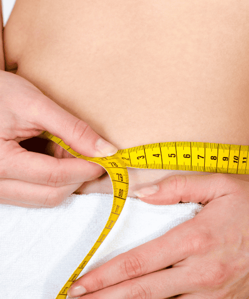 women measuring waist