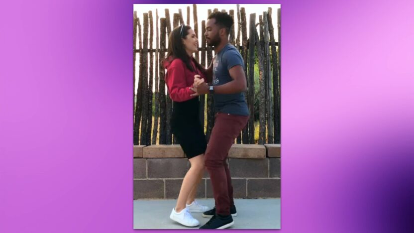Pareja bailando merengue, mostrando los pasos básicos de este baile tradicional dominicano.