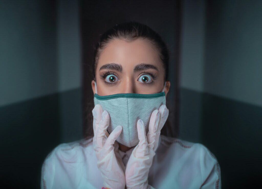 woman-in-white-long-sleeve-shirt-covering-her-face