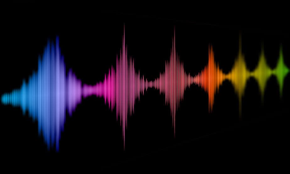 An abstract rainbow-colored sound wave on a black background shows how understanding sound can help soundproofing.
